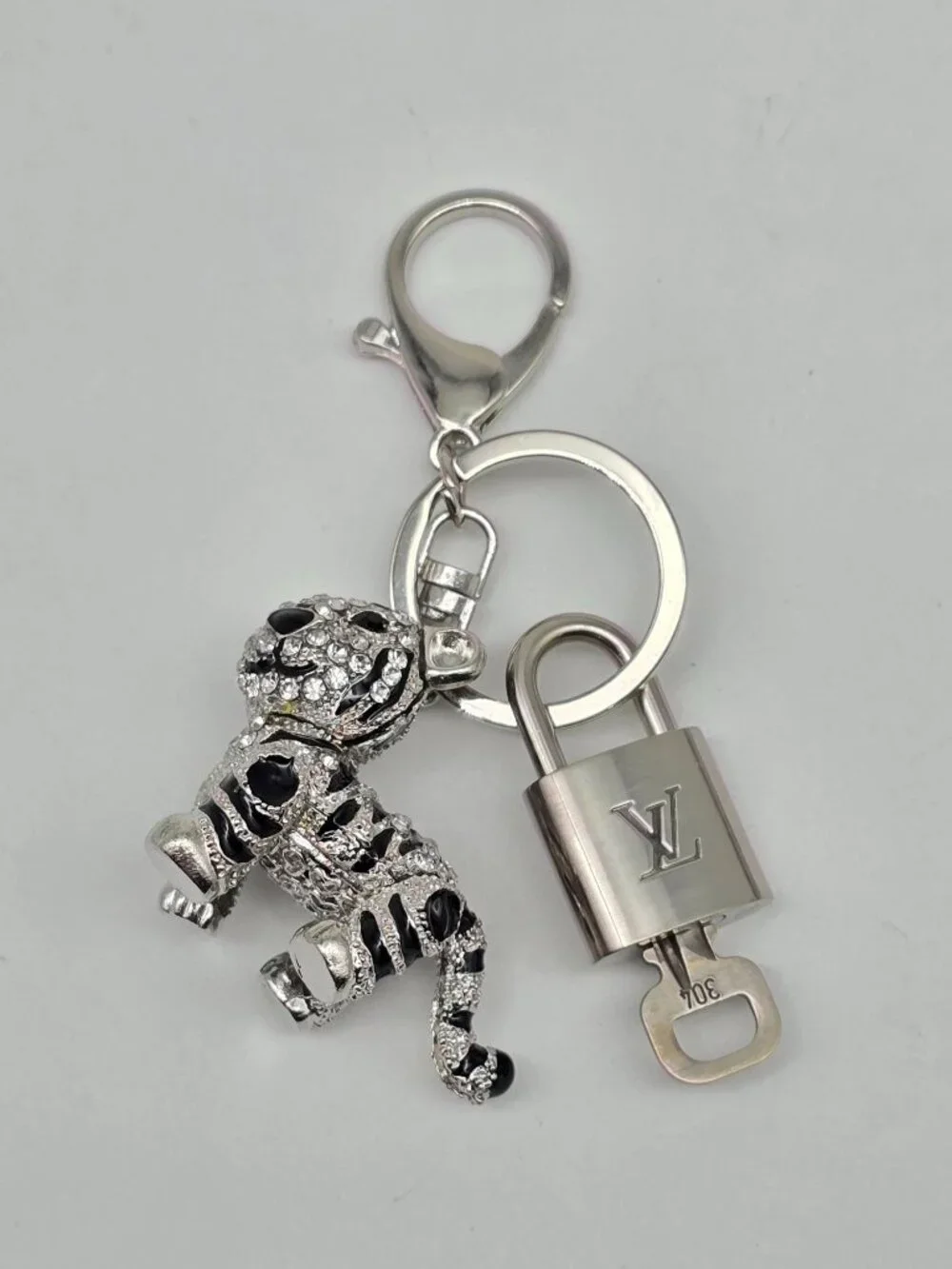 Authentic Louis Vuitton Silver Padlock with Unbranded Silver Tiger Bagcharm
